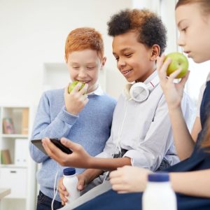 school-children-using-phone-at-school.jpg